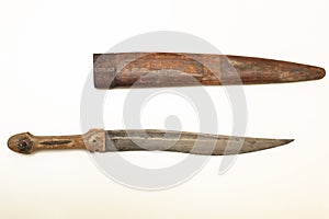 Old knife with wooden scabbard isolated on white