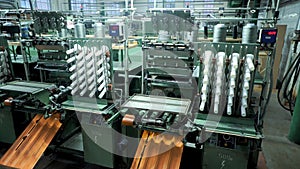 old knitted fabric. Textile factory in spinning production line and a rotating machinery and equipment production