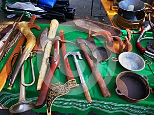 Old knives, bayonets and guns on the table - vintage objects