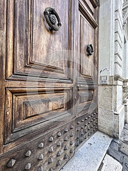 old knockers on wooden door of a building