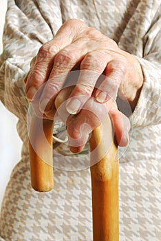 Old Ladies hands with walking stick