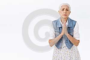 Old lady begging you for favor, need help asap. Modern grandmother asking son listen her, supplicating, plead for photo