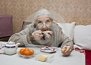 Old lady drinking tea