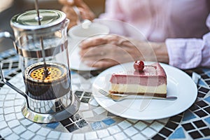 Old lady eating dessert outside