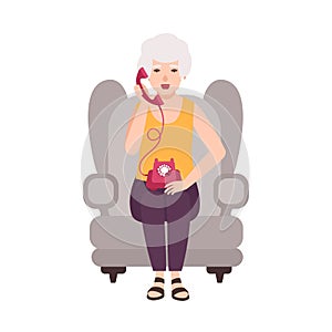 Old lady, elderly woman or granny sitting in cozy armchair and talking on phone. Portrait of grandmother at home