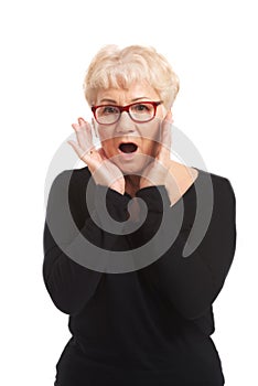 An old lady expresses shock/ surprise.