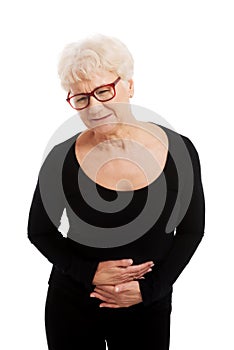 An old lady is having a stomachache.