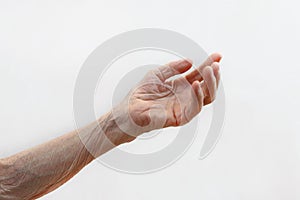 Old lady`s hand. Elderly lady is waiting for help. Elderly concept with light background