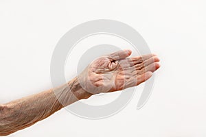 Old lady`s hand. Elderly lady is waiting for help. Elderly concept with light background