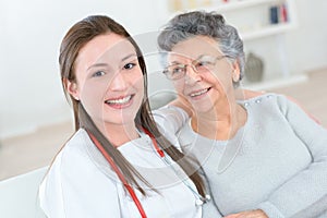 Old lady smiling to nurse