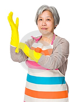 Old lady wear of plastic gloves for protection