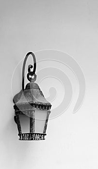 Old lamp against photo