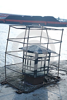 Old lamp with blur coal transportation on musi river