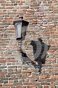 Old lamp on the brick wall