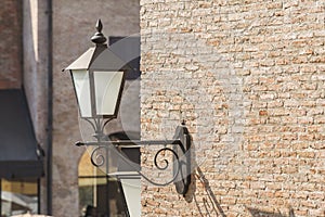 Old lamp on the brick wall