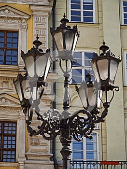 An old lamp post in a European city. Street lights