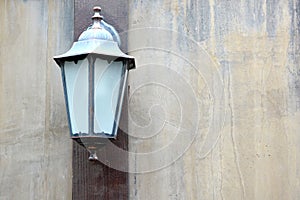 Old lamp vintage on wall grunge background.