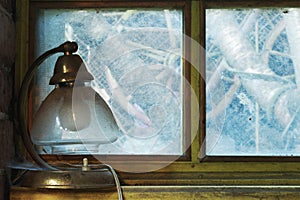 Old lamp on windowsill