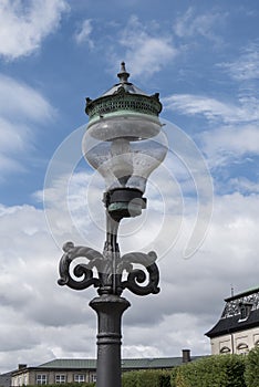 Old lamppost in a street of copenague photo