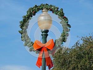 An Old Lamppost with Wreath and Ribbon Bow