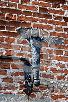 Old lantern on the facad of an old tower. Kremlin in Kolomna, Russia.