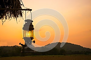 Old Lantern hang a wood in sunset period