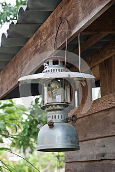 Old lantern hanging on the wooden.