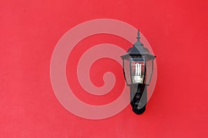 Old Lantern on Red Concrete wall