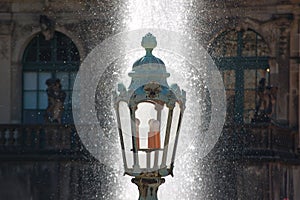 Old lantern and water fountain