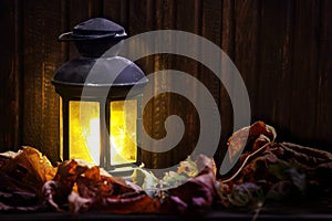 Old lantern on wooden boards