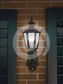 Old lanterns on a house wall in Switzerland