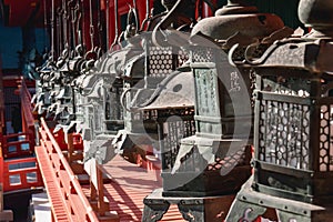 Old lanterns in a thousands lantern temple in Nara Japan