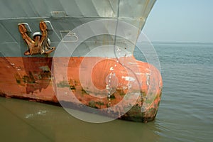 Old large rusty ship moored