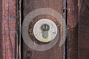 Old latch on red board wall closeup