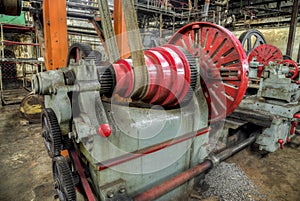 Old lathe driven by belt transmission with different gearing shaft