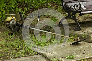 Old lawn mower lying on the floor.