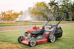 A old lawn mower machine on Grass field