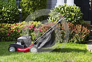 Old Lawnmower on Front Yard Ready for Work