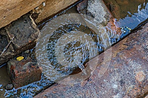 Old leaky pipes in the pit. Preparation for pipe replacement