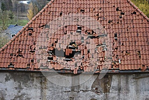 Old leaky red tile roof.