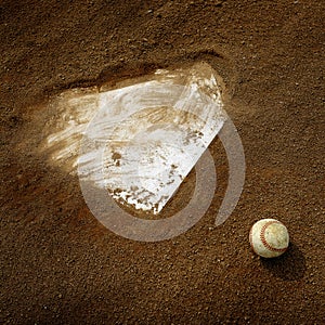 Old Leather Baseball on Field by Home Plate or Base