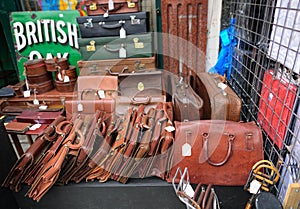 Old leather briefcases on street market stall photo