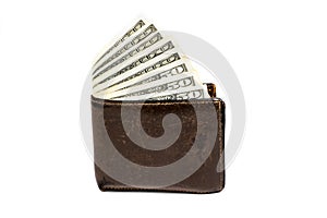 Old leather brown wallet with one and fifty hundred dollars banknotes isolated on white background