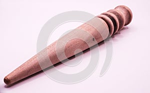 old Leather crafting tool - round wooden Multi-Size Edge Slicker and Burnisher  on white background photo