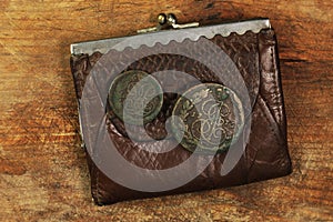 Old leather purse with ancient chinks