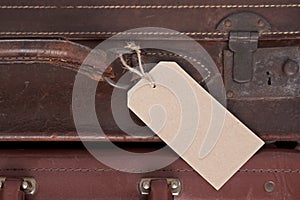 Old leather suitcase with blank label