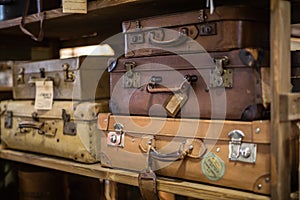 Old Leather Travel Cases on a Shelf