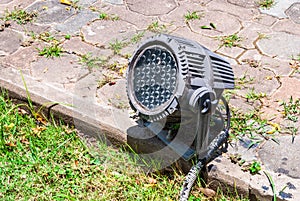 Old LED Spotlight on Concrete Brick Ground, Outdoor