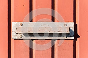 Old letterbox or mailbox in the gate door traditional way of delivering letters or mail to the house address close up