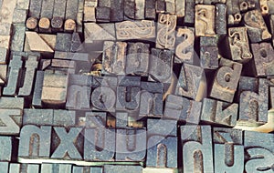 Old letterpress background, close up of many retro, random metal letters